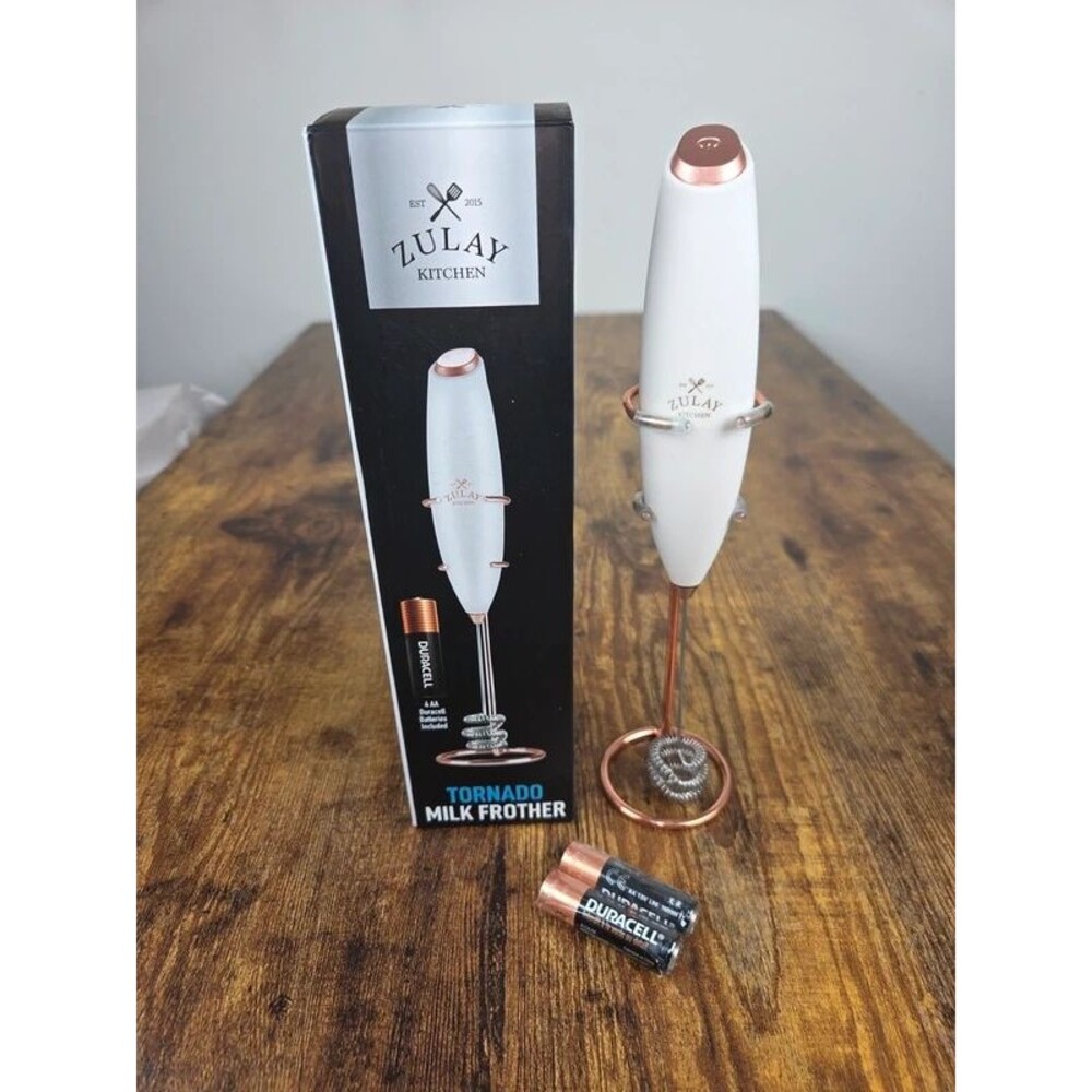 Milk frother with stand.